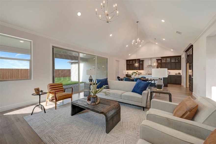 Welcome to refined living in Lavon's thoughtfully planned community, Elevon. Discover where modern design and everyday comfort come together beautifully at 1173 Honey Falls Lane.

This elegant single-story home showcases a meticulously crafted floorplan with spacious living areas, designer finishes, and flexible spaces that adapt to the way you live. From the moment you enter, the welcoming foyer leads into an expansive great room featuring a warming fireplace and filled with natural light—an inviting space anchored by soaring ceilings and an open flow into the dining area and chef-inspired kitchen.

The kitchen serves as the heart of the home, featuring a large center island, ample cabinetry, and generous counter space—perfect for preparing meals, hosting gatherings, or enjoying quiet mornings at home. The open-concept design allows conversations to flow easily between the kitchen, dining, and living areas, creating a warm and connected atmosphere for everyday living.

Privately situated, the primary suite offers a peaceful retreat with an ensuite spa-inspired bath, dual vanities, and an oversized walk-in closet designed for both comfort and convenience. Additional bedrooms provide flexibility for guests, family, or hobbies, while a dedicated home office or activity room offers the ideal setting for working from home or creating a flex space.

Step through the multi-slide door to a 12'x27' covered patio designed for relaxed outdoor living—perfect for weekend barbecues, evening sunsets, or simply unwinding under the Texas sky.

Life in Elevon offers more than just a beautiful home. Residents enjoy access to a vibrant master-planned community with parks, scenic walking trails, playgrounds, gathering spaces, and resort-style amenities designed to bring neighbors together and create lasting memories.

Sophisticated yet welcoming, this home blends thoughtful architecture, modern comfort, and a desirable community setting—an exceptional place to call home.