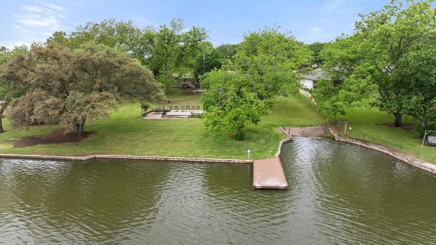 VACATION. INVESTMENT. HOME. Why choose when you can have it all? Welcome to 633 Bridge Street — one of Granbury's most coveted addresses, where lakeside living meets the heartbeat of downtown. Sitting right on the water with 1,704 square feet of comfortable, easy-living space, this single-family gem delivers the kind of lifestyle most people only dream about.

Step outside and you're moments from dining, shopping, parks, the historic square, and everything that makes Granbury one of Texas's most charming destinations. Step inside and you have your own private lakeside retreat. This is the rare property that checks every box — whether you're searching for a primary residence, weekend escape, or a high-demand short-term rental opportunity.

Properties like this don't come around often. Downtown Granbury lakefront homes are a rare commodity, and once they're gone, they're gone. If you've been waiting for the perfect blend of location, lifestyle, and long-term value — your wait is over.

BRING ALL OFFERS — Granbury living at its finest is right here at 633 Bridge Street.