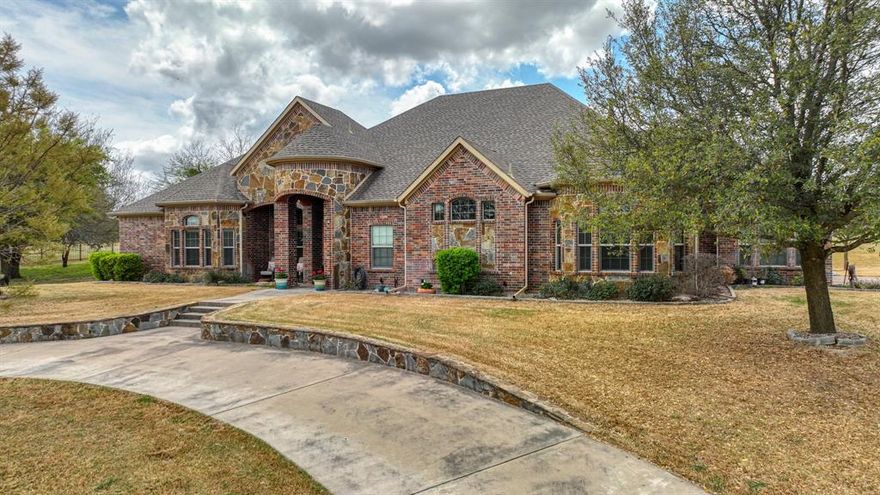 Stunning custom home in Canyon West Golf Community. This home is loaded with custom touches throughout. This is the ultimate family gathering home featuring an open floor plan with a kitchen that'll knock your socks off if you love to entertain and cook for family and friends. Everything is bigger in Texas and this kitchen says that and more. Two gas stoves, two dishwashers, two refrigerators and two sprawling granite covered islands to display your culinary masterpieces. The kitchen opens up to a Texas sized living and dining room. Plenty of space for the party to relax in style while a warm fire in the beautiful stone fireplace keeps everyone cozy. The two guest bedrooms come complete with their own ensuite baths and walk in closets. The Master bedroom is both spacious in design and feel. The master also boasts a stone fireplace for setting the evening ambiance for snug bedtime movies. The spa like master bath is set with his and her vanities, toilets and custom closets. Enjoy the lovely walkthrough shower and separate soaking tub. The exterior of the home has been well maintained and has a wonderful back patio complete with a built-in grill for dinners on the patio. Plenty of parking for you and all your guest. As the home has a 3-car garage, extra side parking and a circle drive in front. Just a short golf cart ride to the Canyon West Club House for drinks is a must for a nice evening out in Canyon West. You'll find easy access to I-20 gives you a swift arrival to Weatherford and Fort Worth. The home is also located in the highly desirable Brock ISD School District.  Come out to Canyon West and see this truly immaculate home and play a round of golf while you're here. Welcome to Canyon West!