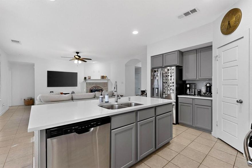 Bright, open, and beautifully crafted Highlands Home, completely move-in ready! Located in North Fort Worth, this home offers quick access to Downtown Fort Worth and the legendary Fort Worth Stockyards, all just a short drive away. Enjoy an unbeatable location steps from the community pool, park, and local schools.

The dream kitchen includes a massive center island with quartz countertops, a gas oven and stove, and stainless steel appliances. It flows into the open-concept dining and living areas, where a wall of windows brings in natural light and showcases the sleek tile flooring. The spacious living room is anchored by a cozy gas log fireplace.

A large utility room provides excellent extra storage with washer and dryer hookups. The primary suite offers a peaceful retreat with double sinks, a garden tub, separate shower, and a generous walk-in closet.

Enjoy covered front and back porches, perfect for relaxing any time of day.

Residents have access to a resort-style community swimming pool, complete with a kids’ splash area and a beautifully designed amenity center.

Truly a must-see!