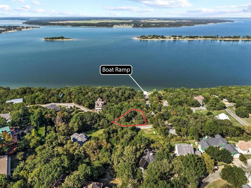 Gorgeous Waterview Lot in Russwood! Build your dream home on this blank canvas with breathtaking Lake Texoma views stretching across Wood and Treasure Islands. Located in the highly desirable Russwood community, this property offers the perfect blend of privacy and convenience. With potential access from both Walnut and Waterview, you’ll have plenty of space for parking your boat, jet skis, or paddleboards—plus the community boat ramp is just steps away! Enjoy the peaceful lake lifestyle with stunning views and direct access to the water right at your fingertips.