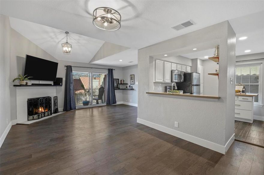 Stylish Condo in the Heart of Dallas! Enjoy urban living with unbeatable access to major highways, top dining spots, shopping, entertainment, and the airport. This beautifully updated condo offers a private balcony, soaring ceilings, and abundant natural light throughout. The spacious layout includes wood-look flooring, a sleek modern fireplace, and eye-catching decorative lighting. The kitchen is a showstopper with quartz countertops, a butcher block island, stainless steel appliances, and a classic subway tile backsplash. Both bathrooms have been tastefully updated with modern finishes. Just steps from the community clubhouse, resort-style pool, and a large open dog park—everything you need is right outside your door!