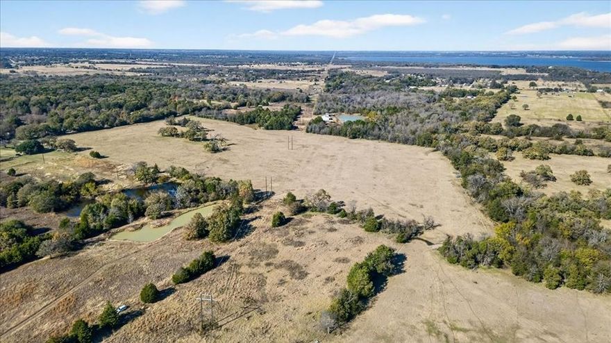 30.4 Acres minutes from Cedar Creek Lake and only one hour from downtown Dallas! Rare opportunity in a highly sought-after East Texas location. The land offers excellent flexibility making it well-suited for investors, multi-generational ownership, or phased development. This property offers the perfect blend of accessibility, privacy, and long-term potential, making it ideal for subdevelopment, a private full-time residence, or weekend country getaways. The surrounding area offers the best of lake-country living, with boating, fishing, golf courses, dining, wineries, and year-round recreation just minutes away, while still providing peaceful countryside views, open space, and lifestyle. Outdoor features include two scenic ponds and cross-fencing that supports livestock, recreation, or agricultural use. Whether your vision includes a serene homestead, a productive farm, a luxury country retreat, or a strategically located investment near one of Texas’s most desirable lakes, this exceptional property is ready to bring your plans to life.  The 30.4 is part of a larger 151.44 acre property.  Current owners are willing to separate the 30.4 acres out of the larger property.  See MLS #21133092 for the 151.44 acre property.