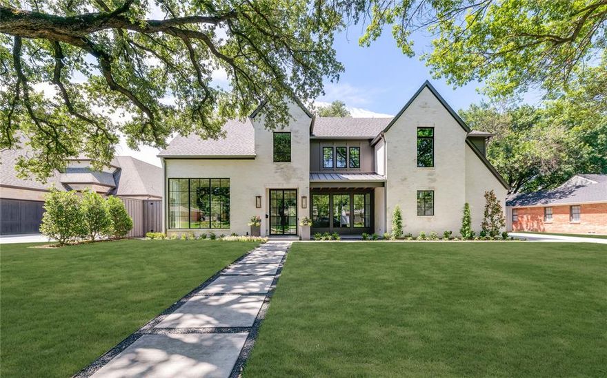 Incredible new construction residence by Langford Custom Homes located on a quiet established street in Preston Hollow on an oversized 100 x 174 interior lot. The stately elevation features antique reclaimed brick with a specialty German schmear finish, 10’ iron double door entry, Bevolo copper gas lanterns and Lincoln aluminum clad windows. At the entry you are greeted by a 2-story grand staircase followed by 13' ceilings in the open concept living area with a 20 x 10 sliding glass wall that overlooks the expansive backyard. The kitchen features rift and quartered white oak custom cabinetry with honed Taj Mahal Quartzite countertops - fully equipped with commercial grade Thermador appliance package. The large breakfast area enjoys floor-to-ceiling windows for extensive views of the backyard. White oak beams and an Isokern fireplace with custom mantel finish off the space. The primary bedroom includes a vaulted ceiling with oak beams. The Primary bathroom features natural marble, dual showers and white oak cabinetry with walk-in closet and hidden safe room. The floor plan includes an additional downstairs bedroom with ensuite bath, 19 x 19 playroom complete with wet bar and sliding glass doors and windows for additional unrestricted views to backyard. Vehicle storage is provided by an oversized 2-car garage with an adjacent single-car garage. The interior garage entry is served by mudroom lockers and additional storage cabinetry. Upstairs features 4 ensuite bedrooms, and a flex exercise, study or game room. Quality finish out includes solid white oak flooring throughout, Phylrich plumbing, Visual Comfort lighting, Riad tile and marble. Excellent location in the private school corridor with the Northaven Trail one-half block from your front door! House is complete and ready for move-in! *Buyer and buyer's agent to verify all information herein*