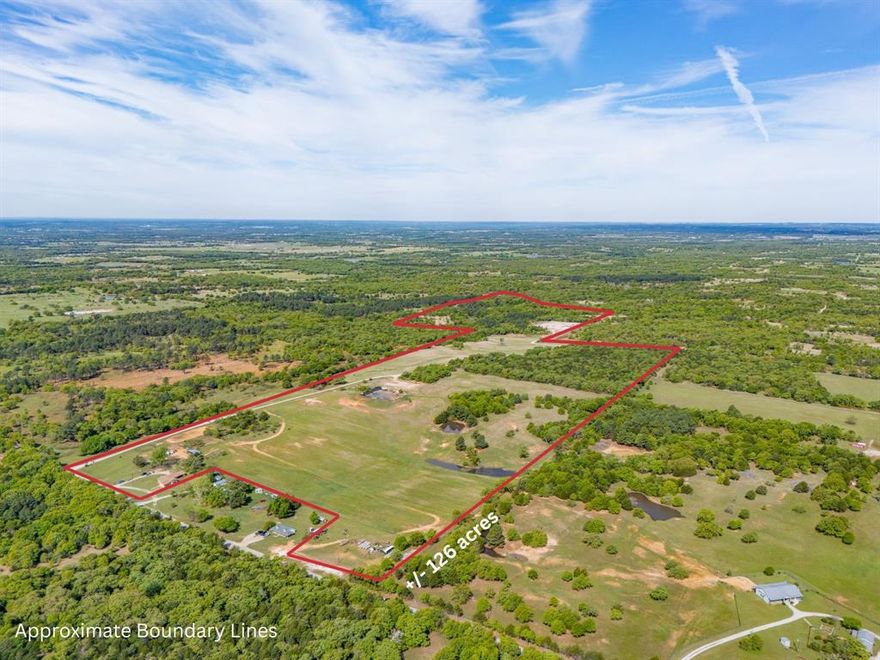 RARE OPPORTUNITY to own a legacy ranch bordering the Lyndon B. Johnson National Grasslands, where horses, cattle, and wide-open Texas skies create a lifestyle impossible to imagine! This AG exempt blend of open coastal pasture ideal for hay production, and natural terrain provides versatility for ranching, livestock, or recreational use. With the National Grasslands bordering the property, outdoor enthusiasts will appreciate direct access to opportunities for horseback riding, hiking, camping, wildlife watching, and exploring the great outdoors. The expansive setting offers incredible privacy while still being conveniently located near town. Offered for sale for the first time in over 100 years, this remarkable plus minus 126-acre ranch presents a rare opportunity to own a legacy property where the seller is willing to convey all mineral rights owned with an acceptable offer. Located just northwest of the Dallas Fort Worth Metroplex. The land features a variety of terrain with beautiful stands of pine, cedar, and mature oak trees on mostly fine sandy loam, creating a scenic and private setting. Two productive coastal pastures provide hay production, typically yielding two cuts per season. Last year one cut yielded about 52 bales averaging approximately 1,100 lbs. each. Water resources include two tanks, a natural spring, and a watershed. The property is fully fenced and well maintained, with firebreaks along portions of the perimeter. The property includes a 1683 SF brick home with about 1.5 acres fenced with an open arena. Direct access to County Road 2690. Bordering three sides of the property is the expansive LBJ National Grasslands, a nearly 20,000-acre federally managed recreation area with over 75 miles of marked trails. Don’t miss your chance to own one of the greatest pieces of Texas. Whether you’re looking for a working ranch, weekend retreat, recreational paradise, or future homesite, this property captures the true spirit of North Texas country living.