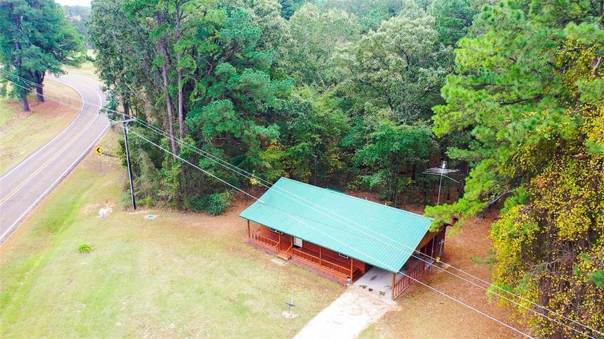 East Texas retreat on 27.88± acres with a well-maintained 2002 home (1,200 sq ft). Rolling pasture, mature timber & a pond make this Bowie County property ideal for hunting, livestock or a weekend escape. Paved FM 561 frontage with utilities and excellent Airbnb rental income potential near Simms, New Boston & Texarkana. Private setting with scenic views and abundant wildlife.