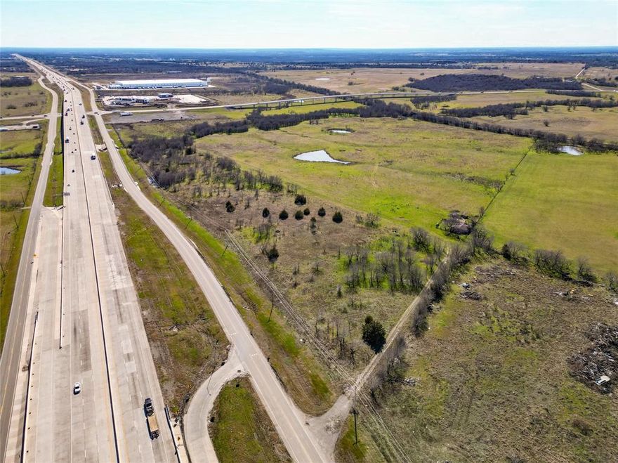 Just over 1800 Feet of Frontage off of the IH45 Service road near the 31 Bypass and IH45 Intersection! Great Visability from IH45! This 11.54 Acres is perfect for a developer or investor looking to develop and build along with the growth in the area! Come in and develop the full acreage, or split up into multiple parcels with the large amount of road frontage. Property Sits Right at the Exit Ramp for the 31 BYpass for easy access. The Service Road runs both North and South allowing you to have access from either direction of travel on the service road. City of Corsicana Water & Sewer Lines run along the front of property. Multiple larger developments and businesses all going in around this area.