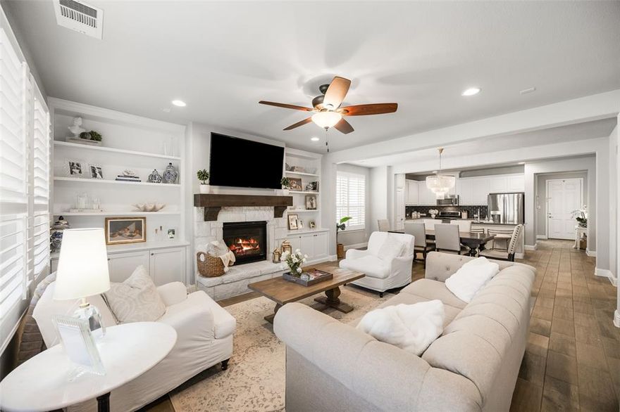 ***SELLER OFFERING 5K TOWARDS BUYERS CLOSING COSTS***Welcome to this immaculate 3bedroom, 2 bath home with a study, located in the vibrant Trinity Falls community. This beautifully designed home boasts designer finishes throughout and offers an unparalleled lifestyle with access to hike and bike trails, 2 community pools, a dog park, splash pad, several parks, and a wide range of community activities. Perfect for those who enjoy an active lifestyle and a strong sense of community! As you step inside, you’re greeted by gorgeous wood-look tile that flows seamlessly through all the living and wet areas, complemented by upgraded carpet in the bedrooms for ultimate comfort. Designer light fixtures and plantation shutters throughout elevate the home’s sophisticated charm, while the extended 2.5 car garage with upgraded overhead storage offers plenty of space for all your storage needs. The heart of this home is the open concept kitchen, ideal for preparing meals and entertaining with family and friends. The kitchen flows into the spacious living area, where you'll find designer built-in cabinets, a striking stone fireplace, and a stunning cedar mantel. A wall of windows fills the room with natural light, creating a warm and inviting space. The home features a thoughtfully designed split bedroom layout, ensuring privacy. The large primary suite is truly an owner’s retreat, complete with an ensuite bath that rivals a spa with its luxurious finishes. The secondary bedrooms share a well appointed bath that’s conveniently located between them, perfect for family or guests. Step outside to your backyard oasis, a covered patio and expansive lot with plenty of room for outdoor activities. The backyard offers privacy and tranquility, and the home is situated on a quiet cul-de-sac lot, providing a peaceful environment for your family to enjoy. This one is sure to please even your pickiest buyers.