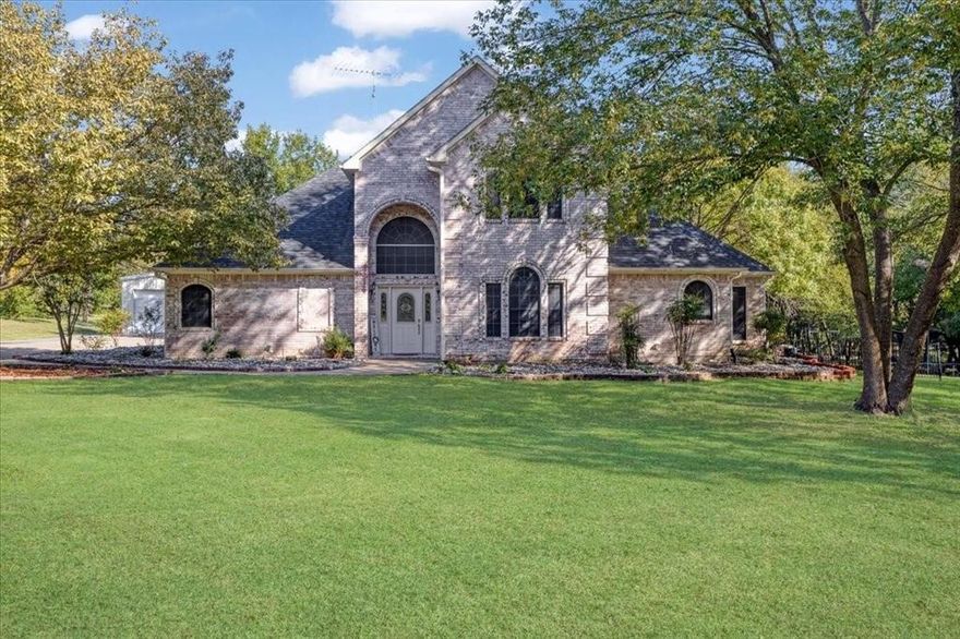 Price Reduced!  Spacious 4 bedroom, 3 bath, 2-story home situated on a peaceful 1.6-acre landscaped and treed lot. The primary suite is conveniently located on the first floor, offering comfort and privacy. The inviting living room features a cozy fireplace, perfect for gatherings. Outside, enjoy your own private oasis with a sparkling pool and plenty of room to entertain. A large shop adds extra versatility for storage, hobbies, or projects. This property combines comfort and functionality with the beauty of a quiet, wooded setting.  You feel as though you are in the country but with city shopping and restaurants  near by.  Just a  short distance to the tech area of Sherman and less than an hour away from the Dallas, Ft Worth Metroplex. Make an appointment to come see your next home. Newly replaced roof