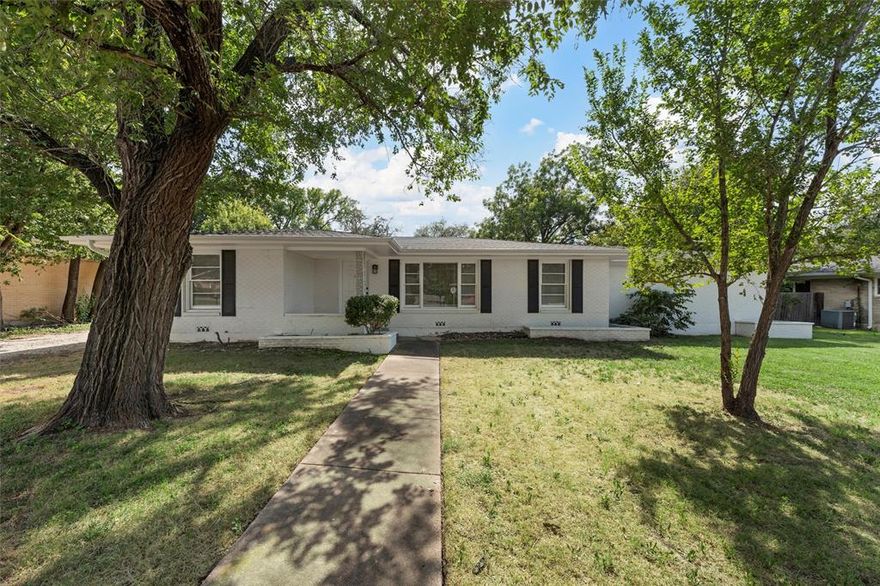 Lovely, freshly updated home located amongst some of Waco's most beautiful residences, beautiful Live Oak trees and nearby commercial amenities such as Target and HEB grocery. With vinyl plank throughout, maintenance and durability are key! The large living dining area welcomes you with tons of natural light, as well as recently updated recessed lighting. The recently updated kitchen is ready to go with refrigerator, double ovens, a large single basin sink, microwave and built in cooktop - all hugged by beautiful granite countertops and tile work. The primary bedroom is unique for this mid-century style home in that not only does it offer a great sized ensuite bathroom, but also a dual access, walk in closet with additional built in storage. Both secondary bedrooms are great in size and share a spacious, recently updated and beautiful hall bathroom. The lot is large and features a rear access, attached carport with plenty of space for 2 cars, plus storage.