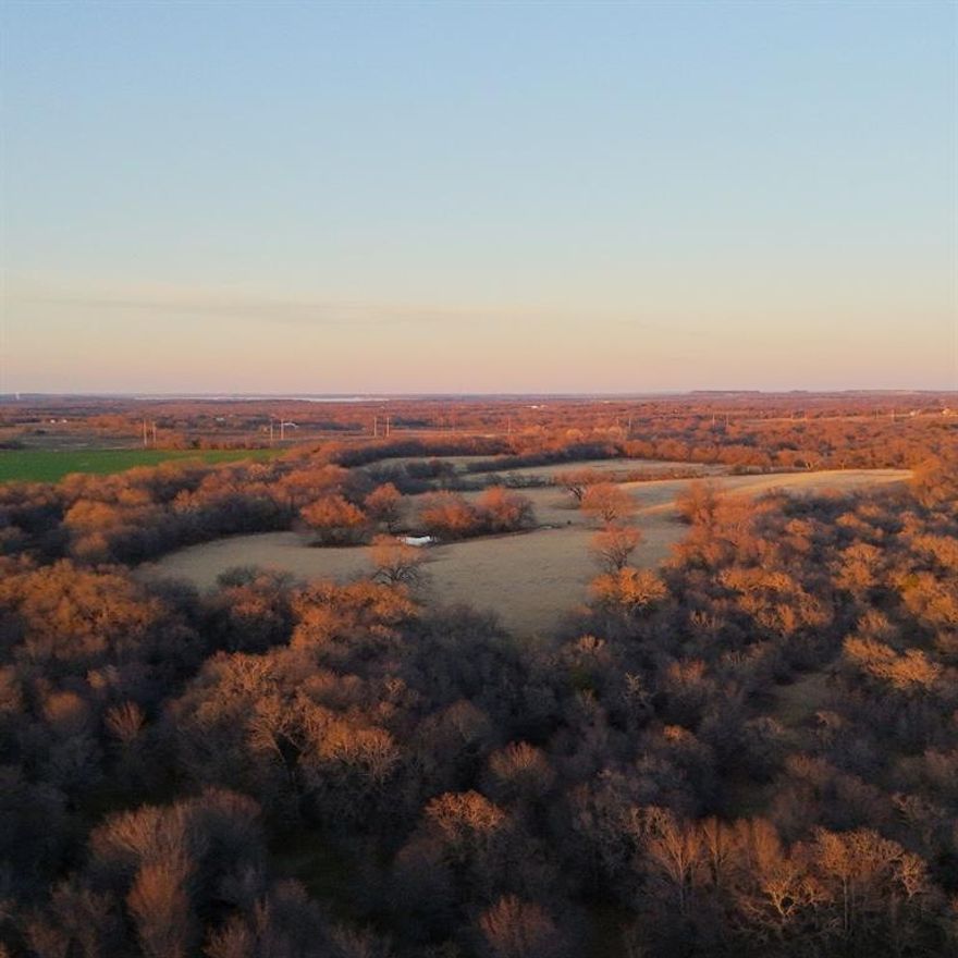 Nestled in the heart of picturesque Boonsville, TX, just one hour from Downtown Fort Worth, this expansive 304-acre tract offers a unique opportunity for buyers seeking versatility and potential. Whether you're in the market for a prime piece of land to run cattle, indulge in hunting, or hold for future development, this property delivers endless possibilities. The land features a mix of open pasture, gently rolling terrain, and wooded areas, creating an ideal environment for both agricultural and recreational uses. It’s a perfect location for a cattle ranch or hunting retreat, with abundant wildlife and ample space to create your own oasis. Whether you're looking to build a dream home, start a ranching operation, or plan a development, this land offers a strong foundation for a variety of endeavors. Water is abundant on the ranch - 3 tanks, 1 well, and a live water creek on the NW side of the property. Two coastal fields producing plenty of hay or could be used for grazing. Schedule your personal tour today!