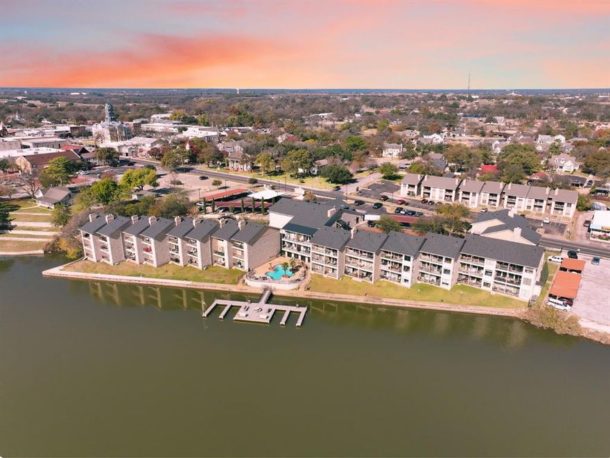 Million dollar views that will wow you every time! This lock and leave waterfront condo is ideally situated within walking distance of Granbury’s Historic Town Square, also known as The Celebration Capital of Texas! This community gives you all the benefits of lakefront living at its finest surrounded by comfort and convenience. 

Located in building 2, the condo features 2 bedrooms, 2 bathrooms, and a versatile office that can serve as a third bedroom for guests. The open-concept living and kitchen area showcases a spacious island, granite countertops, and ample storage. Enjoy meals in the breakfast nook with large windows framing stunning views of Lake Granbury. Step onto the private balcony off the living area—the perfect spot to relax outdoors with no neighbors in sight, offering privacy rarely found in condo living. The master suite boasts an en-suite bathroom and a generously sized closet. An in-unit washer and dryer add extra convenience. 

The Lodge on Lake Granbury is ideally situated near the square for easy access to dining, shopping, and entertainment. The facility offers the use of a day dock and the city boat launch is just down the street, making boating simple and accessible. Community amenities include a shared dock for boat parking, a fitness center, pool, covered parking, and additional storage is available for a fee. HOA dues cover exterior maintenance, lawn care, full use of facilities, water,  internet AND Spectrum Cable! This unit also includes a reserved covered parking space. 

Don’t miss your chance to own this exceptional lakeside retreat!