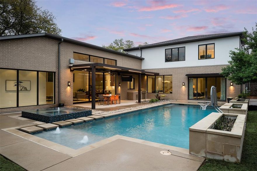 ICF Custom Homes built this modernist construction that was thoughtfully executed with upgrades galore on an oversized Preston Hollow lot just steps from the Northaven Trail and minutes from top rated schools, shopping and dining. Perfect for entertaining or everyday living, this open floorplan is light and bright with tall ceilings providing incredible art walls and views out to the sparkling pool, spa, motorized louvered patio and large grassy play area. Beyond a dramatic floating staircase, the floor plan unfolds into a Great Room with gourmet kitchen equipped with incredible storage, Miele appliances and a separate chef’s pantry. The secluded downstairs owner’s retreat includes a fireplace, mechanical shades, and bathroom with heated floors, a soaking tub, separate shower and large walk-in closet.  Also downstairs is a guest suite and a dedicated office. Upstairs are three en-suite bedrooms with spacious walk-in closets and a large game room overlooking the private backyard oasis.