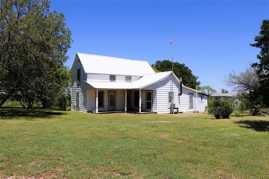 Early 1900's Ranch house with barn and pens sitting on rolling 50 Acres in South Clay County. Beautiful view of cleared native pasture with hardwood trees along seasonal creek that feeds the stock pond. Lots of wildlife with white tail deer, turkey, wild hogs, dove, ducks and varmints. Home has an open living area with wood stove, one bedroom and bath downstairs and two bedrooms upstairs. Stand alone garage has insulated game room. Barn is approx. 30 x 40 with concrete floor and shed side for horses. Loafing shed with working pens and load out chute for cattle. Good working water well. Native grass pasture could be managed or planted into improved grasses for hay production.
