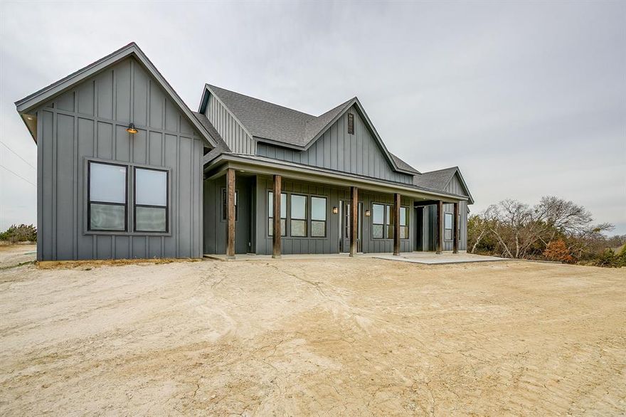 Bank Owned New Build. Peaster ISD! 2+acres. in new suburban subdivision. Great corner lot. Lots of space and privacy. Beautiful modern home. Light and Bright open floorplan. Lots of natural wood throughout. Many modern elements but keeping in the traditional style. Craftsman-style interior doors. Cozy & inviting stone wood burning fireplace.  Kitchen has solid surface counters with large farmhouse sink and oversized commercial grade range with exhaust. Nice sized laundry with tons of cabinet space and storage.  Upstairs has a great bonus room with closet & bath. Back covered patio is large and fantastic for entertaining. Two ceiling fans and outdoor stone wood burning fireplace with entries to main living and to garage. Three-car garage with mudroom entry. Lots of room for a shop or a pool. High elevation with pretty views.