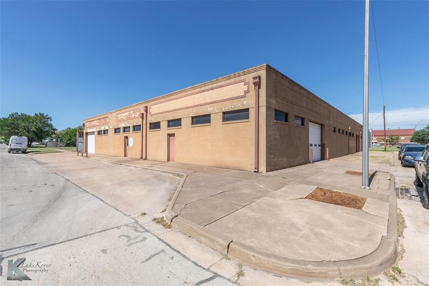 Rare Commercial Opportunity in Downtown Abilene. Unlock the potential of your business at this versatile commercial property located at 202 Elm Street, nestled in the heart of downtown Abilene. Positioned in an Opportunity Zone, this space provides ample opportunities for tax benefits and is exceptionally accessible via public transportation routes. Its strategic location boasts proximity to vibrant city amenities and walkable attractions, including shops, dining, and professional services, making it an ideal spot for your business venture. This expansive property offers a robust blend of features suitable for various business models. It’s a brick-constructed, multi-functional structure with a generous floor plan that includes a variety of interior spaces. The property features several offices, a conference room, and a breakroom kitchen area. There is a separate commercial kitchen equipped with a commercial vent hood, making it perfect for a restaurant or food service establishment. The inclusion of a walk-in cooler and a cardboard baler further enhances its usability for restaurant, retail or warehousing operations. Complementing the flexibility of this property are two restrooms, an upstairs storage loft, and a useful pull-through design. The layout can comfortably accommodate a fitness facility, event venue, or educational center as well. Exterior features include ample parking options and multiple overhead doors, ensuring ease of access for deliveries, customer flow, or gym members. This property is an excellent choice for retailers, restaurateurs, or entrepreneurs seeking a supportive environment to grow their business. With onsite parking available, convenience is a hallmark of this location, whether you're looking to attract clients, customers, or partners. Don't miss out on this distinctive opportunity in one of Abilene’s most promising areas.