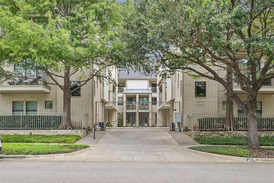 Looking for a lock & leave home in a gated community with an abundance of natural light, cozy fireplace, space to entertain inside and outside, and the opportunity to walk through your neighborhood to enjoy local hotspots?

3926 Holland Avenue #102 is a stylish, updated and sunlit home near Turtle Creek with gated access, outdoor living spaces across two levels, and thoughtful updates throughout. One of only two units in the complex with 2425 square feet and 3 bedrooms all with ensuite bathrooms, this is a rare turn-key opportunity for neighborhood living on a tree-lined street in a bustling area of Dallas.

A perfect layout for entertaining friends and family, the main living area features an open concept floor plan with 10-foot ceilings, abundant natural light, a gas fireplace, and an updated wet bar with beverage fridge. The chef’s kitchen includes a 4-burner gas range, an oversized island and ample storage and countertop space.  Enjoy sunrise, sunset or quiet time from the covered balcony off the kitchen’s breakfast area or reading nook.

The light-filled primary bedroom on the 3rd floor includes a sitting or workout area, and the large, windowed bathroom has dual vanities, a separate walk-in shower and jetted tub. The utility room is conveniently located on the 3rd floor, as is an updated guest room with large walk-in shower.

On the ground floor, a spacious bedroom-office-second living area with full bath opens onto a fully enclosed, recently turfed (2024) private yard that provides over 350 sq ft of outdoor space for relaxing or entertaining. The attached, 2-car garage has new epoxy flooring. Additional updates include: hardwood floors, Roman shades, updated bathrooms with new tubs, tile, toilets, frameless glass panels and more!

The neighborhood is conveniently located in 75219 and is easy to enjoy walkable access to all of the dining and amenities along the Katy Trail, Turtle Creek, Highland Park, Uptown and Cedar Springs.