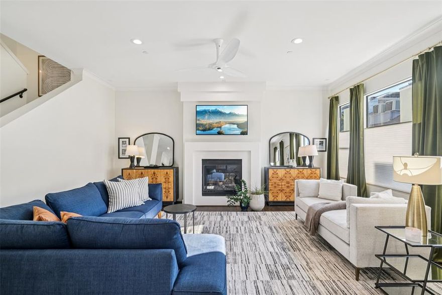 Looking for a lock & leave home in a gated community with an abundance of natural light, cozy fireplace, space to entertain inside and outside, and the opportunity to walk through your neighborhood to enjoy local hotspots?

3926 Holland Avenue #102 is a stylish, updated and sunlit home near Turtle Creek with gated access, outdoor living spaces across two levels, and thoughtful updates throughout. One of only two units in the complex with 2425 square feet and 3 bedrooms all with ensuite bathrooms, this is a rare turn-key opportunity for neighborhood living on a tree-lined street in a bustling area of Dallas.

A perfect layout for entertaining friends and family, the main living area features an open concept floor plan with 10-foot ceilings, abundant natural light, a gas fireplace, and an updated wet bar with beverage fridge. The chef’s kitchen includes a 4-burner gas range, an oversized island and ample storage and countertop space.  Enjoy sunrise, sunset or quiet time from the covered balcony off the kitchen’s breakfast area or reading nook.

The light-filled primary bedroom on the 3rd floor includes a sitting or workout area, and the large, windowed bathroom has dual vanities, a separate walk-in shower and jetted tub. The utility room is conveniently located on the 3rd floor, as is an updated guest room with large walk-in shower.

On the ground floor, a spacious bedroom-office-second living area with full bath opens onto a fully enclosed, recently turfed (2024) private yard that provides over 350 sq ft of outdoor space for relaxing or entertaining. The attached, 2-car garage has new epoxy flooring. Additional updates include: hardwood floors, Roman shades, updated bathrooms with new tubs, tile, toilets, frameless glass panels and more!

The neighborhood is conveniently located in 75219 and is easy to enjoy walkable access to all of the dining and amenities along the Katy Trail, Turtle Creek, Highland Park, Uptown and Cedar Springs.