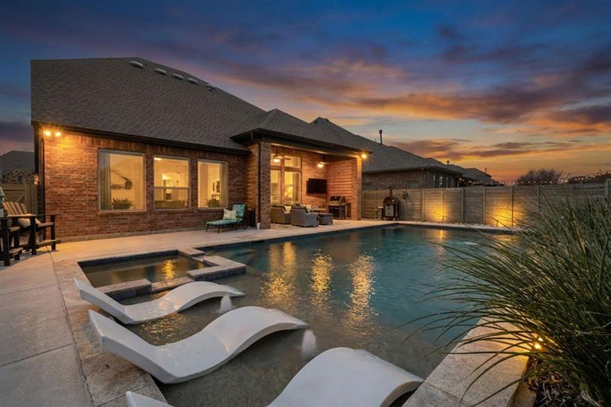 Experience resort style living in this stunning 4 bedroom, 4 bath David Weekley home, meticulously maintained and thoughtfully upgraded for comfort, style, and effortless entertaining.

The first floor offers a beautifully flowing layout with a dedicated home office featuring custom built ins, formal dining, and a true chef’s kitchen equipped with premium Viking appliances (refrigerator conveys). Stylish custom barn doors lead to the pantry, and additional under-stair storage adds everyday convenience. The spacious laundry room includes custom cabinetry and stacked LG ThinQ washer and dryer. Tucked down a private hallway, a secondary bedroom and full bath provide the perfect space for guests, while the serene primary suite offers a peaceful retreat complete with a custom closet you have to see to believe.

Upstairs features oversized bedrooms each with private baths, a large open loft ideal for a game room or playroom, an expanded workshop space, and additional walk-in attic storage.

The backyard is the true showstopper—featuring a breathtaking saltwater pool with tanning ledge and spa, an expanded covered patio perfect for entertaining, and low-maintenance pet-ready turf creating a private oasis right at home.