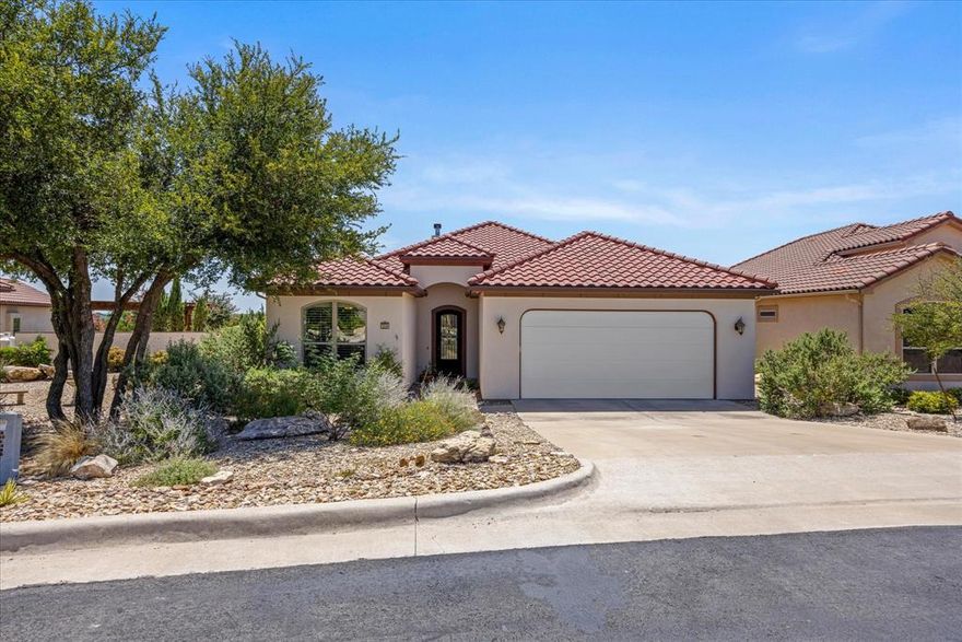 This beautiful 3-bedroom, 2-bathroom home showcases classic southwestern architecture with an authentic Spanish tile roof. Living room, kitchen and dining spaces are open to one another perfect for hosting. The living room focal point is the floor to ceiling stone fireplace. The home office is right off the living room and features elegant french doors and a closet. Gorgeous cherry cabinetry and granite countertops are found throughout the entire home. The kitchen has dual sinks, double ovens and views. Off the kitchen you'll find a spacious laundry with storage, sink and a walk-in pantry. The primary suite serves as a true retreat with dual vanities providing ample space for two, a relaxing soaking tub for unwinding, a separate shower for convenience, and a private toilet room. Generous storage with two spacious closets in the primary bedroom. Outside, the low-maintenance yard allows you to enjoy your free time while still having an attractive outdoor space. The home's positioning takes full advantage of beautiful sunsets and sunrises.
Community amenities enhance the lifestyle with a sparkling pool perfect for relaxation and exercise, scenic walking trails for outdoor enthusiasts, and a peaceful fishing pond for those who enjoy a quiet afternoon by the water.