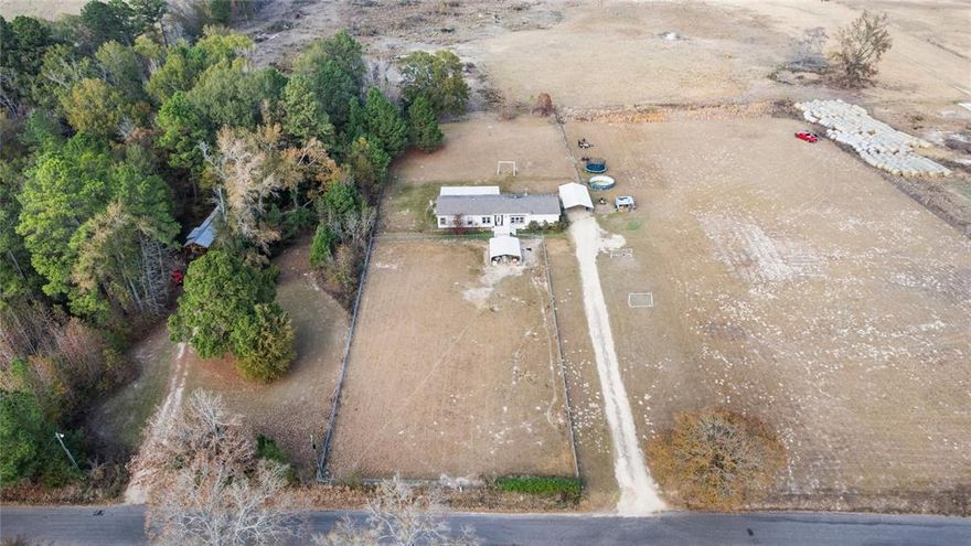 Spacious 4 bedroom, 2.5 bath home set on just over 2 acres, perfectly positioned near Longview and Tyler. Close enough for an easy commute, yet far enough to enjoy peaceful country living. This home features an open floor plan with no carpet throughout, offering easy maintenance and modern appeal. The primary suite includes a relaxing soaking tub and separate shower, creating a comfortable private retreat. Recent updates include a new septic tank, adding peace of mind for the next owner. Outdoors, enjoy a partially gated yard, extended driveway, and covered parking, ideal for multiple vehicles, equipment, or outdoor hobbies. With room to spread out and space to breathe, this property offers the perfect balance of convenience, privacy, and country charm.