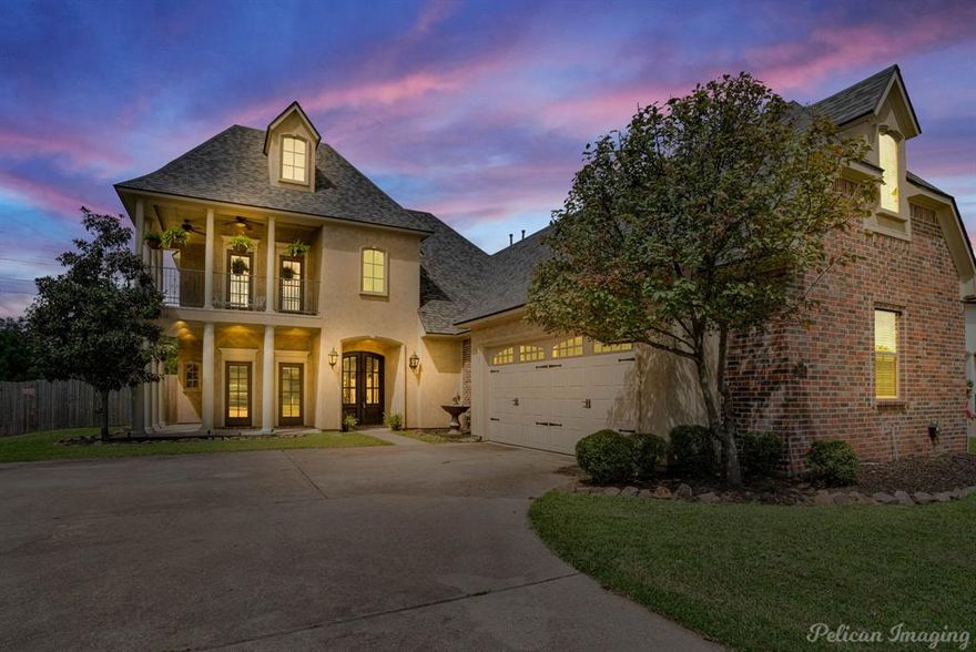 Welcome to Turtle Creek Subdivision in beautiful Benton, LA, just minutes away from the State Park! This gated community features a clubhouse with year-round events, perfect for socializing and entertainment. The home offers an open floor plan, ideal for modern living. Enjoy the cozy fireplace in the living room or relax on the balcony upstairs. The separate dining room provides a designated space for family meals and gatherings. The kitchen boasts a spacious island with seating, gas cooktop, wall oven & microwave, along with a pot filler, making it a great spot for casual meals or entertaining. The large, fully fenced backyard is perfect for outdoor activities, complete with an outdoor kitchen with built in grill, green egg & mini fridge. Experience the best of Turtle Creek living in this beautiful home!