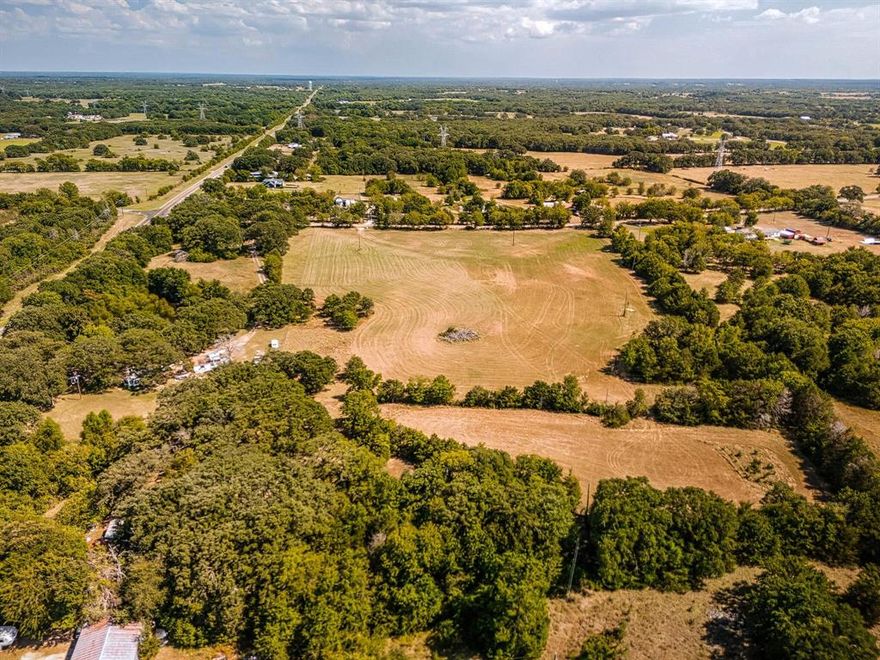 12.29 Acres in Van Zandt County.No Restrictions! Just 15 minutes north of Wills Point, this 12.29-acre property delivers the wide-open Texas lifestyle buyers are searching for. With no deed restrictions, you can build your dream home, barndominium, or weekend retreat, or simply bring your animals and enjoy the peace of country living. The land is partially fenced and cross-fenced, and water and electric are available at the road (installation required). You’re only 20–25 minutes from Lake Tawakoni and about an hour from Rockwall, offering the perfect balance of country quiet and city convenience. Whether you’re ready to build now or want a land investment with options, this property is ready for your vision.