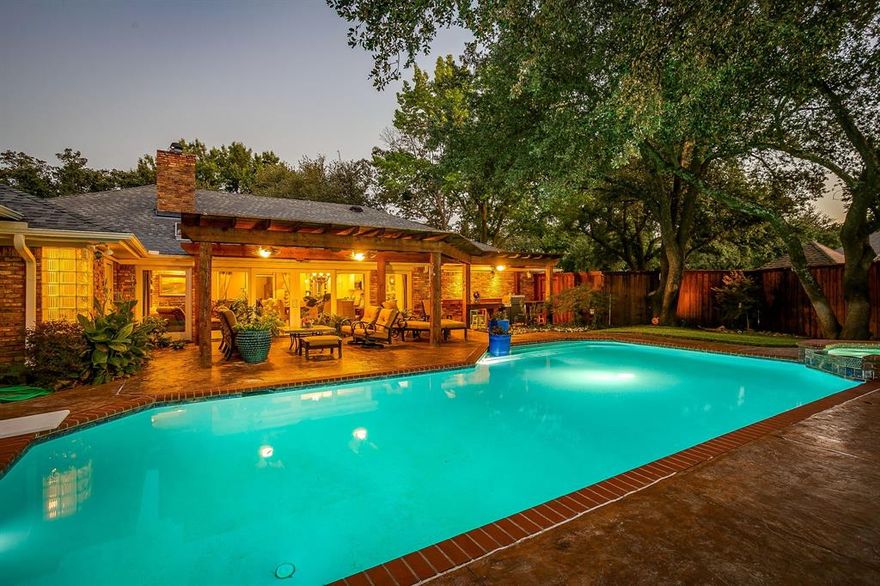 Step into this beautifully updated home in one of South Arlington’s most desirable neighborhoods, offering easy access to I-20 and an oversized lot adorned with mature trees. The backyard is a true paradise with a sparkling pool and ample space for entertaining. Inside, the spacious open concept layout features a double sided fireplace seamlessly connecting the living, dining, and kitchen areas. Pella sliding glass doors stretch across the back of the home, fully opening to the backyard for effortless indoor-outdoor living. This home has been thoughtfully updated over the years, including remodeled bathrooms, new Pella sliding and back doors, a new pergola, dual LG split AC units with all-new ductwork, roof replacement and new Pella multi-opening windows. Recent enhancements include new landscaping and drainage improvements, a new double wide concrete driveway, fresh bedroom carpeting, new exterior ceiling fans, and a newly epoxy coated garage floor. The kitchen is outfitted with KitchenAid appliances, including a French door refrigerator, dishwasher, and double oven range, offering both style and functionality. Every detail of this home has been carefully considered to provide comfort, convenience, and a seamless lifestyle. This exceptional South Arlington residence combines modern updates, thoughtful design, and unparalleled outdoor living, a true gem ready to enjoy!