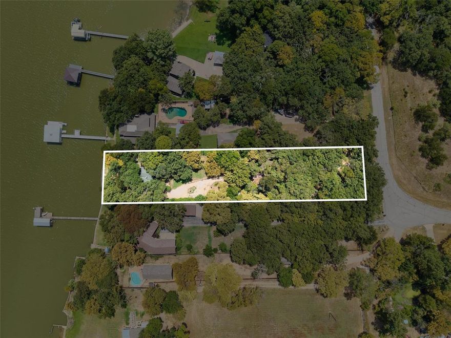 Welcome to your lakeside getaway, where the views seem to go on forever. If you’ve been waiting for the perfect place to “make your own,” your search is over!

This 2-bedroom, 2-bath home with sunroom sits tucked behind a gated entry and shaded by beautiful mature trees, offering privacy and tranquility. The property spans 1.22 acres with approximately 100 feet of deep-water frontage, making it ideal for lakeside living, fishing, or simply soaking in the serene setting.  There is also a small guest quarters on the property with open living bedroom, full bath and kitchenette.

Whether you’re looking for a weekend escape, an investment opportunity, a full renovation project, or maybe clear the lot and start over.... this property is the perfect canvas for your vision.

Property is being sold AS IS.