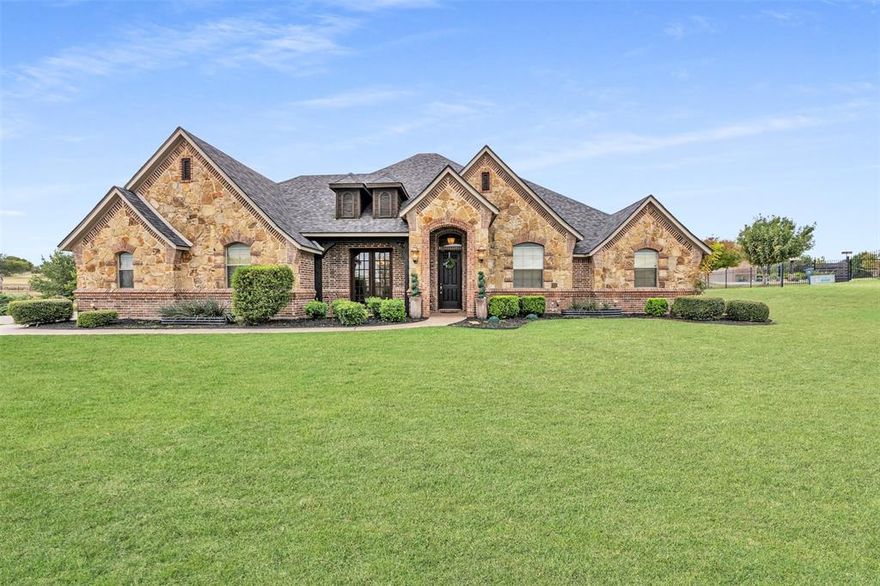 Welcome to Mustang Creek Estates—where country life meets city convenience. Wide-open skies, spacious lots, and neighborly charm create a peaceful, easygoing lifestyle, all just minutes from Benbrook Lake, shopping, hospitals, and entertainment. Located within Godley ISD, this beautifully updated home on a 1.3-acre lot blends Hill Country inspired design with modern elegance. Step inside to find fresh paint, brand-new carpet, and an inviting open layout filled with natural light. The spacious kitchen opens to the living area, perfect for hosting family and friends. The primary suite offers a relaxing retreat with an oversized bath and large walk-in closet. Outside, enjoy an outdoor fireplace, built-in smoker and BBQ, and a greenhouse ideal for garden lovers. Conveniently near Chisholm Trail Parkway, this move-in-ready home perfectly balances warmth, luxury, and livability.