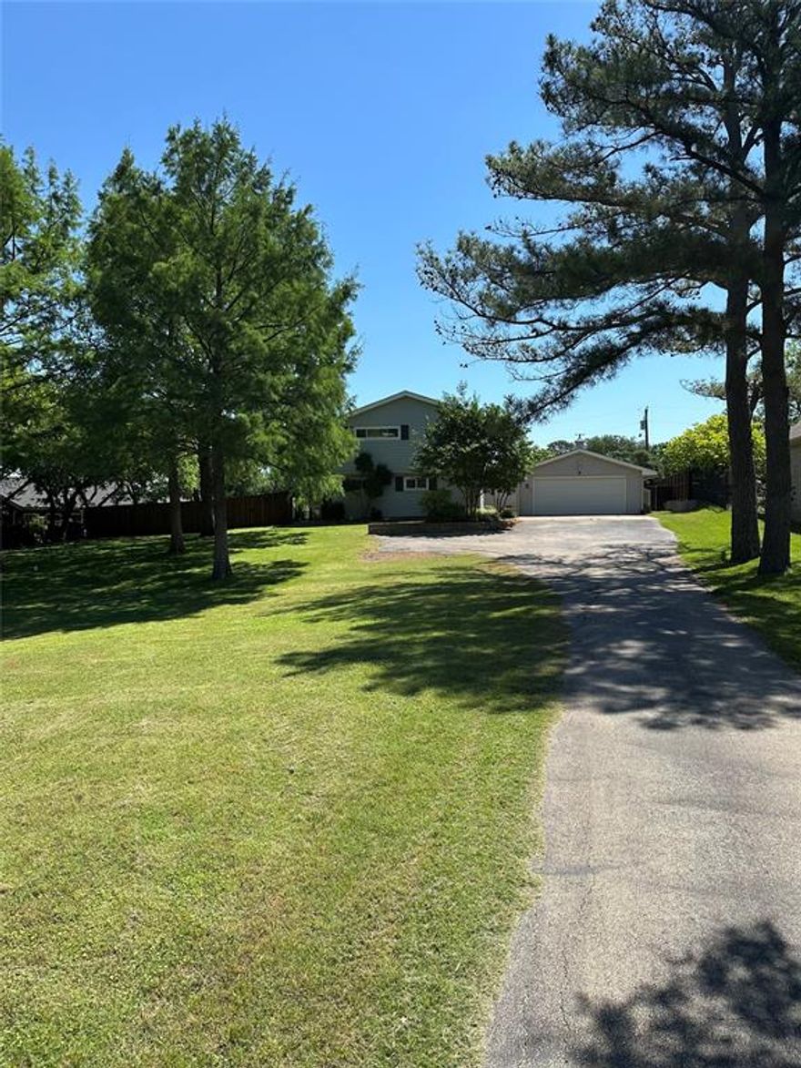 NO HOA, LAKE VIEWS, ROOM to ADD guest house, call agent for more info! Location is amazing!! List of Updates & Upgrades in docs with $248,000 worth of work done. Prepare meals in kitchen w views of Lake Lewisville or relax in the hot tub with lake views- stunning! Home features 2 primary suites. One primary suite located downstairs w 2 separate closets, remodeled bathroom. Secondary primary bedroom located upstairs with its own private deck, built 2024, & a remodeled bathroom. Or use the upstairs room as a huge game room. Office could be 5th bedroom has a closet and shares bathroom with other bedroom. Beautiful eat in kitchen features gas cooktop & plenty of space for entertaining. Living room features a remodeled fireplace with new firebox that makes for a cozy place to sit by the fire. Enjoy resort-style outdoor living with a sparkling salt water pool & spa with views of the lake, a built-in grill with a spacious dining area, & multiple backyard spaces designed for relaxation and entertaining. Three separate backyard areas are perfect for anything from creating a garden to running around to hosting parties. Courtyard is perfectly placed between the garage & home. One secondary bdrm, that was completely remodeled down to the studs, leads to the backyard w the shed. It has its own private covered back patio. Perfect for guests or anyone who would like to have their own entrance. Some updates include new engineered hardwood floors, completely redone drainage, new sprinkler lines, every gas line redone with the ability to convert existing hot water heaters into tankless, brand new deck off of primary bedroom with gorgeous views of the lake, interior doors replaced with solid core doors, new windows throughout. Convenient access to 35E or 2499 (Long Prairie Rd) for easy commute to DFW or downtown Dallas. Located near shopping, Doubletree Ranch Park with splash pad, Lakeside Community Park for lake swimming or kayaks, & this neighborhood has private access to the lake.