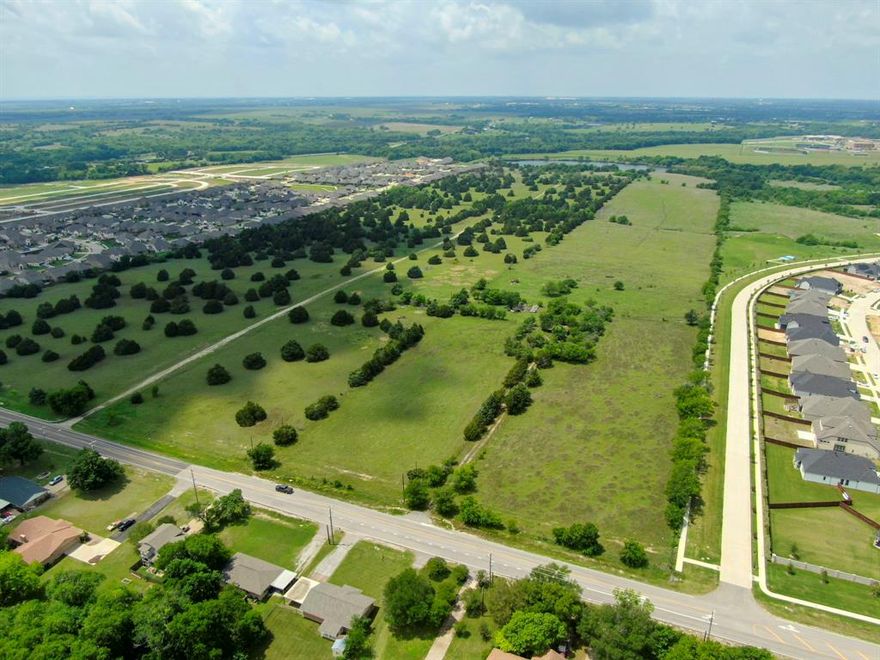Rarely does a site of this caliber come to market. This stunning 120-acre waterfront tract offers unmatched development potential in one of the DFW Metroplex's fastest-growing corridors. Currently zoned SF-1, the property sits flanked by two established residential communities zoned SF-2 and PD-SF-3, demonstrating a clear market precedent for density and providing a compelling case for rezoning or planned development designation. Direct lake frontage and mature scattered hardwoods create exceptional natural amenities that translate directly into premium lot values. A 24-inch water line at the street significantly reduces infrastructure risk and accelerates project timelines. With strong rooftop density surrounding the site, proven neighborhood absorption on both sides, and explosive population growth driving continued demand, this is a generational land play. Whether your vision is a master-planned residential community or a mixed-use development blending retail, commercial, and residential, this property delivers the location, infrastructure, and natural setting to execute at the highest level.