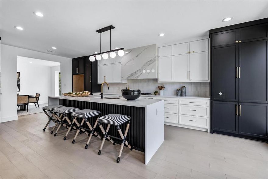 The modern luxury you’ve been searching for in Irving’s coveted guard gated golf course community, Hackberry Estates. This home has been taken to the studs and renovated to reveal its awesome potential. A soaring entry and wrap around staircase greets you, followed by all new white oak flooring throughout. The elegant study is oversized with designer accents. The stunning kitchen is an entertainers dream with two tone soft close custom cabinets, a 36” porcelain Venthood, and all new stainless steel appliances. Large mud room and half bath are down, as well as a primary retreat, fit for royalty, the bathroom complete with soaking tub and shower, 48” porcelain tiles, natural white oak cabinets and champagne fixtures. Upstairs you’ll find an enormous loft area, with another flex space, 3 large bedrooms, and two full bathrooms. A rare find in the heart of it all, do not miss this gorgeous home.