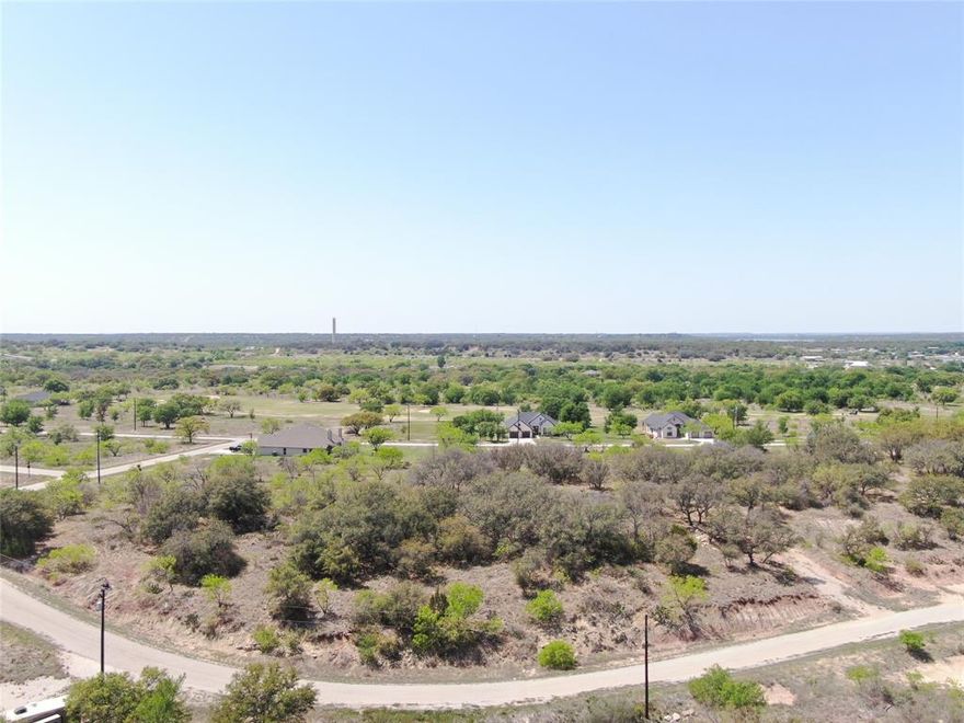 Welcome to your future homesite! This beautiful 0.35-acre lot is ideally situated near The Hideout Golf Course and offers breathtaking views of Lake Brownwood. Whether you're looking to build your dream home, a weekend getaway, or an investment property, this lot is ready for you to bring your vision to life. Located in a peaceful and scenic area, Lot 271 Summer Wind Dr offers a perfect balance of relaxation and recreation. Enjoy nearby amenities like golfing, boating, fishing, and hiking, all while taking in the natural beauty of the lake and surrounding landscape. Utilities are available, making this property a breeze to build on. Don't miss this opportunity to own a piece of paradise near one of Texas’ hidden gems!