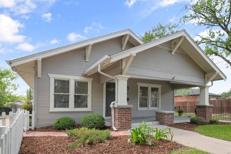Great location and only 1 mile to Magnolia St. Move in condition and completely updated. Wonderful oversized front porch with rollable shade. Spacious kitchen with lots of tall cabinets and counter top. Gas range, granite counters & under mount farm sink. Beautiful wood floors with carpet only in bedrooms. Master bath with walk in shower, two sinks & granite counter tops, toilet replaced 2016. Gas heat & water heater. Home is fenced all around. Electric gate to driveway. Complete foundation repair 2018. Custom iron fence 2016. New roof 2016. Gutters installed with leaf guards 2019. Carpet replaced in primary bedroom 2025. Professionally painted outside 2016. Alarm and sensors on all windows 2016. Custom entry door installed on back of garage for rear entry from alley and overhead lighting. New sprinkler control installed 2026. Great insulation. Corner lot. Private backyard.