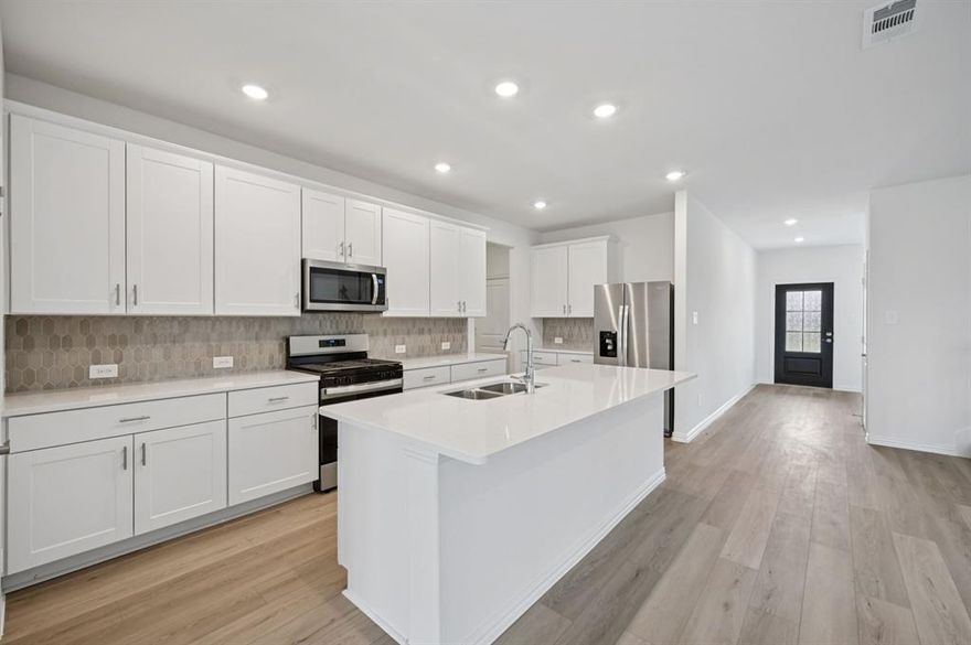 Brand new, energy-efficient home available by Nov 2025! Try a new recipe in the Woodside’s impressive kitchen, complete with a useful island and large pantry. White cabinets with veined white quartz countertops, muted beige EVP flooring with light taupe carpet. Spend the weekends debating what activity to do in this amenity-filled community, make a splash in the resort-style pool, pick up a game of basketball, or let the kids loose on the playground. With quick access to US 380, residents will enjoy the benefits of a short commute to downtown McKinney, Frisco, or Richardson to enjoy nearby shopping and entertainment.  Each of our homes is built with innovative, energy-efficient features designed to help you enjoy more savings, better health, real comfort and peace of mind.