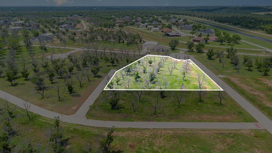 Welcome to an incredible opportunity to create your custom home and private hangar in the prestigious, gated community of Pecan Plantation in Granbury, TX. This expansive, level lot—spanning over an acre—is perfectly situated with direct taxiway access to the community’s paved and lighted runway (FAA Identifier: 66TE), offering the ultimate convenience for aviation enthusiasts. From your backyard hangar, you can taxi straight to takeoff.

Set within a secure, gated, and guarded neighborhood, this property offers both peace of mind and an unmatched lifestyle. Pecan Plantation boasts a wealth of amenities including an 18-hole golf course, clubhouse and restaurant, multiple community pools, campground, private marina and dock with access to Lake Granbury, fishing ponds, RV parking, riding stables, dog parks, and more. Stay active with tennis and pickleball courts, jogging and bike paths, parks, and playgrounds—or take advantage of the community’s convenience with on-site services such as a grocery store, hardware store, pharmacy, clinic, veterinarian, car wash, restaurant, and bank.

With paved roads, electric service, and MUD water and sewer available, this homesite is ready for your vision. Whether you’re planning a peaceful retirement, a family home with room to grow, or the ultimate aviation lifestyle, this is your canvas to bring it all to life.