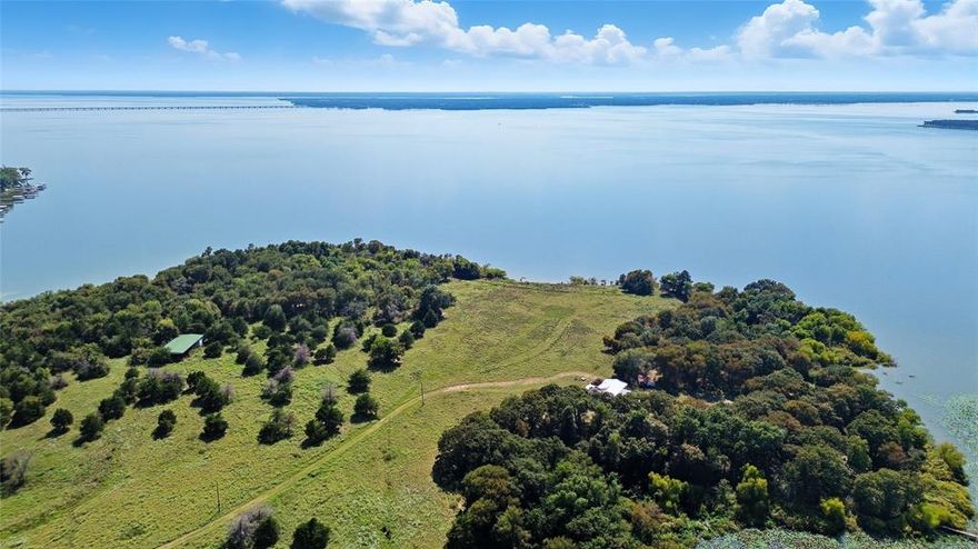 A property of this scale, beauty, and exclusivity rarely reaches the market. Spanning 79.958 acres of private, manicured land on its own peninsula, this Lake Tawakoni treasure offers limitless potential—whether as a world-class private estate or as the foundation for an exclusive luxury waterfront community. For the discerning buyer seeking privacy, the land offers the opportunity to design a majestic compound—a custom-built estate with water views from every room, complemented by a guest house, sports courts, equestrian facilities, and a resort-style pool. A private dock, complete with a boat slip and lift plus separate watercraft lift, ensures seamless access to lakefront living at its finest. But beyond the dream of a private sanctuary lies a vision few properties can accommodate: an investor’s opportunity to create a one-of-a-kind, gated community of custom lakefront homes. Imagine a collection of luxury residences, each with direct water access, curated for those who desire exclusivity, natural beauty, and the serenity of lake life. With nearly 80 acres and expansive shoreline, the development possibilities are truly unparalleled. Whether you envision a personal estate unlike any other, or you see the promise of developing a legacy community that redefines waterfront living, this property delivers. Few opportunities of this scale and rarity ever reach the market. More than land, this is the foundation of a legacy—an exclusive peninsula on Lake Tawakoni, ready to become either a landmark estate or a luxury waterfront enclave for generations to come.