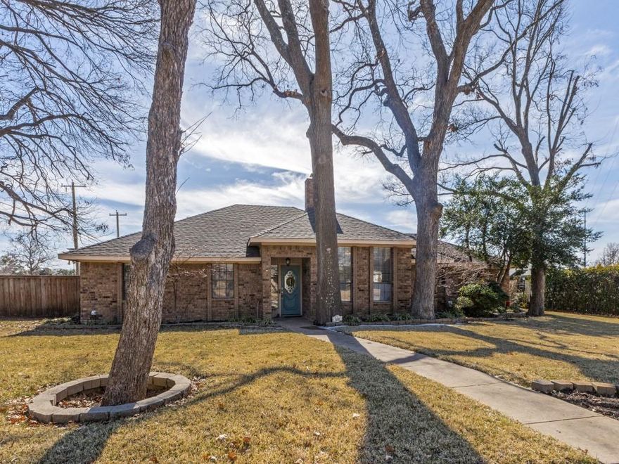 Experience the perfect blend of timeless charm and modern comfort in this stunning 5 bedroom residence, perfectly situated on a premier one third of an acre corner lot within the highly sought-after Toler Bay community. Framed by majestic mature trees and located just moments from the shores of Lake Ray Hubbard, this home offers a rare opportunity for those seeking space, versatility, and a sense of established community. The heart of the home is an expansive living area defined by vaulted ceilings and an abundance of natural light that creates an inviting atmosphere for daily living. Whether you’re hosting family gatherings or enjoying a quiet evening, the seamless flow into the large kitchen makes it the center of the home, featuring island with cooktop, double ovens, ample storage, and a spacious dining area. This hard-to-find floor plan is ideal for multigenerational living, offering a split guest bedroom with a private bath that serves perfectly as an in-law suite or a secluded home office. An additional flex space ensures you have room for games, reading, working out, kids play area... While the Texas-sized utility provides ultimate practical convenience with space for freezer, storage, 2nd pantry... Step outside to your private retreat featuring a patio with a pergola overlooking a beautiful backyard. The oversized garage, plus additional covered and uncovered parking, easily accommodates multiple vehicles, a boat, or an RV. Conveniently located near premier dining, shopping, and entertainment with easy highway access for a smooth commute across the Metroplex, this home offers the space you need in a location you'll love.