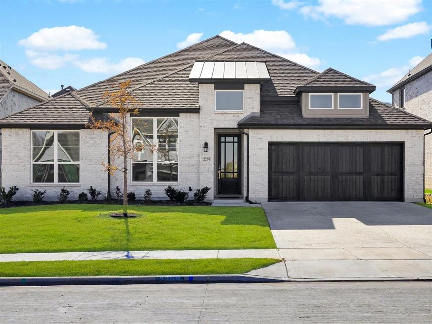 Located in Rockwall’s sought-after Nelson Lake community—a rare opportunity to own a nearly new 2024-built Pacesetter Home without waiting on new construction. This modern single-story beauty combines luxurious design with everyday comfort, featuring 4 spacious bedrooms, 3 full baths, a private office, and a 3-car garage.

Step inside to soaring vaulted ceilings and a light-filled open-concept living area perfect for entertaining. The gourmet kitchen steals the show with a massive quartz island, stainless steel GE appliances, a 5-burner gas cooktop, and dual pantries—including a butler’s pantry and walk-in pantry.

The primary retreat feels like a spa getaway with a soaking tub, glass-enclosed shower, dual vanities, and an oversized walk-in closet. Three additional bedrooms share a private wing with their own game room—ideal for family hangouts or guests.

Enjoy evenings on your covered patio or stroll to the neighborhood pool, playground, and walking trails just minutes away. Smart home features, energy-efficient design, and a quiet interior lot complete the picture.

This home offers the perfect blend of new construction style, location, and move-in-ready convenience—all within Rockwall ISD’s top-rated schools and only minutes from Lake Ray Hubbard, dining, and shopping.