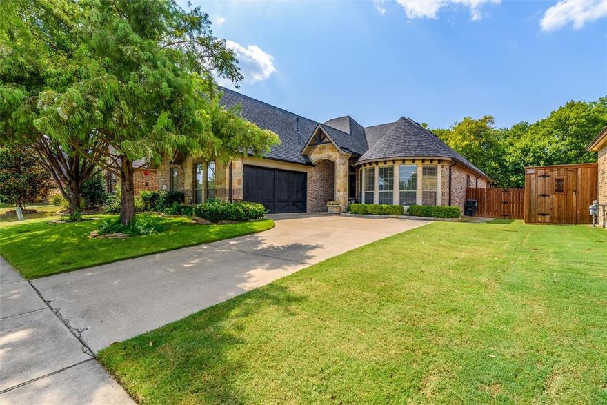 BACK ON THE MARKET DUE TO CIRCUMSTANCES UNRELATED TO THE PROPERTY! Stunning home in sought after Flag Stone Creek Estates! As you arrive you can't miss the curb appeal zoysia grass and stunning landscaping. With its functional floor plan entertaining will be a breeze! The updated kitchen is on trend with upgraded appliances & quartz counter-tops. The large primary suite, split from the other bedrooms, is suited to relaxation with a wall of windows, seating area, and updated bath featuring a claw-foot soaking tub, separate shower, and walk-in closet. A cozy office & three other bedrooms of ample size. Open-Concept living area and updated kitchen flow seamlessly onto the large covered patio offering views of the stunning backyard. Located on a quiet exterior street the gorgeous backyard is flanked by a retaining wall that is heavily treed adding an element of privacy to the beautiful outdoor space. Conveniently located near Sapphire Bay and the best of Rockwall!