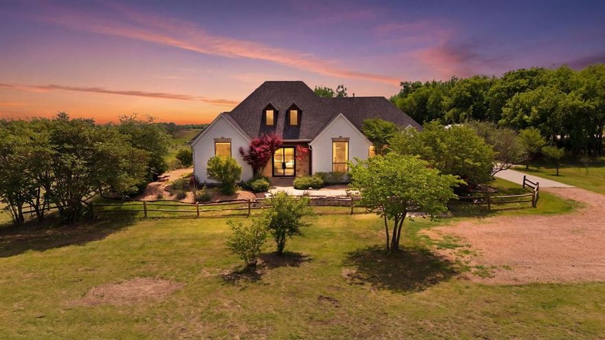 Escape to the ultimate North Texas sanctuary where modern luxury meets the freedom of the ranch lifestyle. Nestled on approximately 7 scenic, ag-exempt acres outside Celina city limits, this estate is designed for families who refuse to compromise on style or space. With no HOA and three gated entrances, the property offers a rare level of privacy and accessibility for multi-vehicle families, trailers, or livestock.

The 2,400 sq ft farmhouse is a masterclass in custom character, featuring soaring ceilings with exposed timber beams, whitewashed walls, and designer finishes throughout. The thoughtful 4-bedroom, 3-bath layout is a dream for multigenerational families, anchored by two spacious ensuite retreats with oversized closets. A wall of glass opens the living room to a resort-style backyard, where a heated pool and hot tub await under the vast Texas sky.

Beyond the home, the lifestyle infrastructure is unmatched. A custom shop—complete with electricity and fans—serves as a premier home gym or workspace. The land is fully prepared for your homestead dreams with a two-stall barn, chicken coop, multiple fenced pastures, and a private pond. Enjoy the simple luxury of picking fresh fruit and blackberries from your own yard in a community known for its top-tier schools and rapid growth.

Opportunities to own acreage of this caliber in Celina are disappearing. This isn't just a home; it’s a legacy for your family to grow, play, and thrive. Schedule your private tour today to secure your piece of the North Texas countryside.