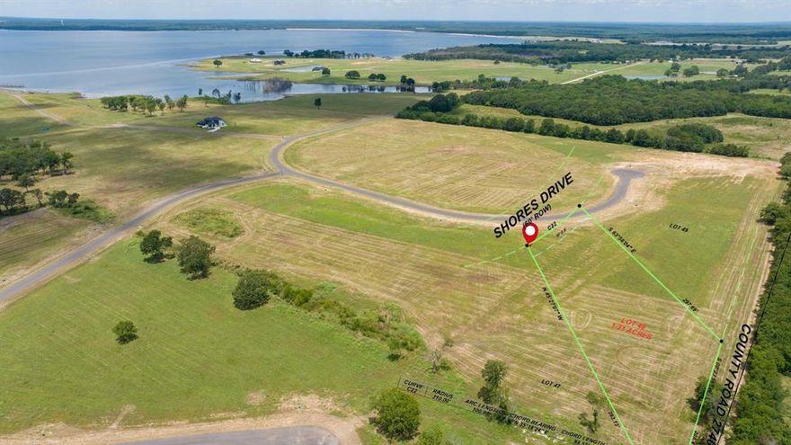 Lot 48 (Marker 148) in The Shores at The Peninsula on Bois d’Arc Lake!

Discover the perfect canvas for your dream home, vacation getaway, or investment retreat in The Shores at The Peninsula—an exclusive, gated lake community in charming Honey Grove, TX. This spacious 1.31-acre interior lot is nestled within a bring-your-own-builder neighborhood, giving you the flexibility to design and build your vision from the ground up.

A rare find in such a prestigious setting. Whether you're chasing peace and quiet, lakeside adventure, or a smart investment with short-term rentals (7 day minimum stay on the entire property, not an out building) allowed, this property checks every box.

Community Perks Include:
A resort-style clubhouse with a fitness center, observation deck & mini golf
Gated entrances for added security
Outdoor cooking area perfect for entertaining
Park Update: The concrete for the cart path has begun install. The tennis courts and dog park will be next.
8-Slip Marina: The 8-slip marina will be finished this summer.
Shores Marina: The Shores marina is ready for use.
Peninsula Marina: The Peninsula 20 slip marina getting the gangway attached. 
Coming Soon: paddleboard-kayak launch, pickleball and tennis courts, multi-use sports field, fenced dog park, playground, and more!

This lot is just a short golf cart ride away from all current and upcoming amenities. Imagine starting your mornings with lake breezes, enjoying sunset cruises, or relaxing at the clubhouse after a full day on the water.

Don’t miss this chance to own a slice of lakeside paradise at an unbeatable value. Bring your dreams. Bring your builder. And bring your future to life at Bois d’Arc Lake.

Buyer to verify all information.