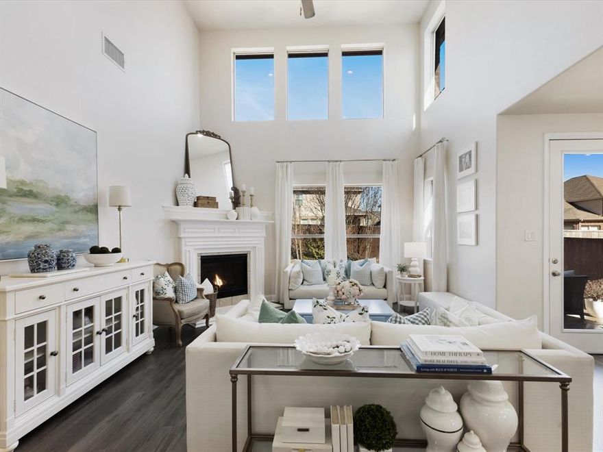 Welcome to a stunning beauty. This gorgeous home nestled in the Inwood Hills community has been featured in multiple National design magazines & is now available! The thoughtfully enhanced residence impresses throughout. Your neighborhood pool & park are blocks away as well as McKinney's Bonnie Wenk Park. Additionally, access to shopping, dining & entertainment options are within 2 miles, including Costco & Cinemark Movies. In the heart of the home, a Chef-inspired kitchen showcases European-styled cabinetry, a new Empava 30in freestanding gas range, marble subway tile backsplash & granite countertops. A custom-built fireplace hearth & mantle provide a stunning focal point in the living room, flooded with natural light. This family friendly space is perfect for everyday living & entertaining. Durable SpillDefense laminate flooring adds balance of style to many rooms freshly painted. Curated touches include upgraded lighting & ceiling fans, crown molding with custom millwork & 6in baseboards in main living areas. Located on the first floor is an office with glass french doors perfect for working from home. Into the expansive mudroom you see updated polished marble flooring, a custom storage bench, hooks, cubbies, & built-in laundry shelving which deliver exceptional organization with elevated style. Bathrooms have been tastefully refreshed with custom framed mirrors, lighting, fixtures, paint, & hardware. Upstairs, 4 spacious bedrooms connect to a 2nd living space & bathroom which is thoughtfully designed. A double vanity with a private shower & toilet enclosure offers simultaneous morning routines & functionality. The home is designed with practicality as well, as it includes spray foam insulation enhancing year-round comfort & energy efficiency. Enjoy Texas evenings on the extended back patio while enjoying gorgeous landscaping. Blending luxury finishes, abundant storage, and seamless indoor-outdoor living, this is an exceptional opportunity for the right family.