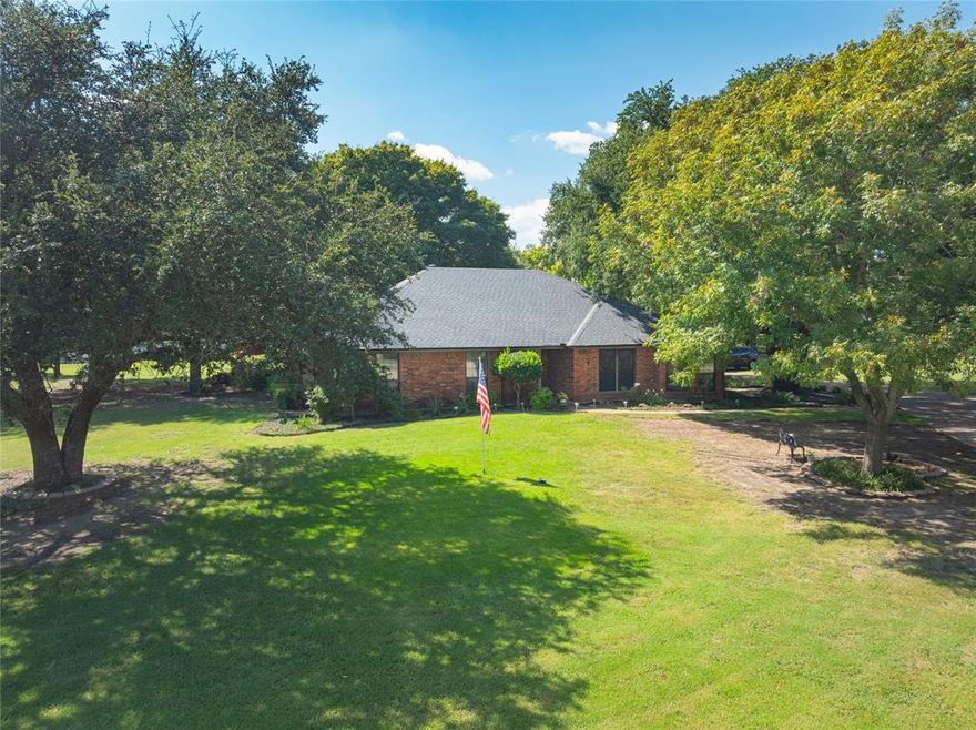 Look no longer, just listed and perfect for your family!! Timeless brick residence nestled on 1.5 picturesque acres adorned with mature trees, creating a private and tranquil setting. This distinguished property offers a serene country atmosphere within a quiet, well-kept subdivision, while remaining just minutes from the conveniences and opportunities of nearby major cities. A spacious storage building adds versatility, ideal for hobbies or equipment. With its combination of natural beauty, privacy, and accessibility, this property presents a rare opportunity to enjoy refined country living with easy urban access. “Refined Country Living with City Convenience” Step inside to find an inviting floorplan with two spacious living areas, including a cozy living room anchored by a classic brick fireplace and a second space perfect for gatherings or relaxation. A wet bar and oversized laundry room adds to the home’s appeal, making entertaining effortless. The kitchen is both beautiful and functional, featuring modern updates, ample cabinetry, and thoughtful design. The large primary retreat offers a private escape with dual sinks, his and her closets, and a layout designed for comfort. Great floorplan that flows easy for the family. Additional features include a storage building for hobbies or tools, and plenty of outdoor space shaded by mature trees to enjoy year-round. **This home presents a rare opportunity to experience refined country living with city conveniences close at hand.**“Timeless Brick Home on 1.5 Scenic Acres, ” “Private Acreage Retreat Minutes from the City”
“Charming Country Setting, Close to Everything”
“Peaceful Acreage in a Sought-After Location”