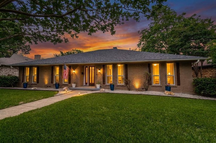 Welcome to a home where every detail matters. Zoned for the highly desired Richardson ISD, this timeless brick home has been reimagined with an elegant, warm feel, showcasing stunning gold accents, plantation shutters, all-new designer LED fixtures, and new energy-efficient windows. The heart of the home is a breathtaking open-concept layout where the oversized living area, anchored by a floor-to-ceiling stacked stone fireplace, flows seamlessly into a chef's dream kitchen. Outfitted with freshly painted shaker cabinets and granite countertops, the kitchen features a new gas cooktop, luxury stainless steel appliances, and a massive island that provides the perfect centerpiece for this entertainer's paradise. Retreat to the oversized primary suite, your personal sanctuary featuring a second cozy fireplace and the ultimate luxury: separate his-and-hers closets. The spa-like bathrooms are equally impressive, with one boasting a deep soaking tub and a separate glass shower, while a designated office with designer privacy glass doors creates the ideal work-from-home sanctuary. Step outside to discover a private, fully-fenced backyard oasis. The location is ideal, with a beautiful park just across the street featuring a playground and duck pond, plus easy access to major highways and White Rock Lake. Every inch of this home has been perfected with its high-end renovation plus major updates including a (2019) roof, a (2020) HVAC system, and new HVAC ducts (2018), making this a rare opportunity to own a truly move-in-ready gem. Schedule your showing today before it's gone.