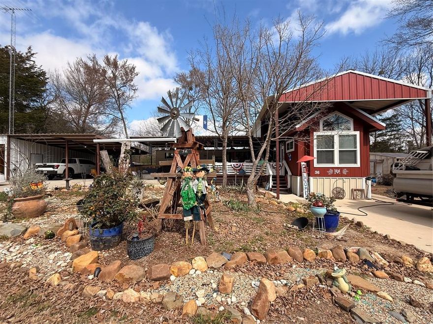 Oh my! This property has so much to offer! Located in the private gated community of White Oak Shores at the famous Lake Fork Reservoir. Located on 6 spacious lots, there is tons of charm and so much potential.  There is a spacious 2022 park model, purchased brand new in 2024, a cozy 1998 RV and an additional 200 square foot custom office space or bunk house.  As you walk up the steps to the there is a large 15x20 deck to enjoy the warm summer nights.  In addition there is a huge shop that is heated, cooled and spray foam insulated ,with a private bath in the back.  Lastly.. you have the adorable greenhouse on 2 lots that could be subsided or separated if you so desired. There is cement pads under all construction and 2 additional covered parking spaces.  White Oak Shores features a private boat ramp and dock, as well as a community clubhouse and pool.