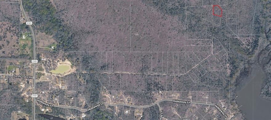 Heavily treed lot in a very secluded location with frontage on a cove of Lake Tawakoni. Located approximately a mile off FM 2101, this property offers a rustic location for outdoor activities. This property is accessible via an unimproved road. There are no utilities available. Adjacent tract is available MLS 21227572