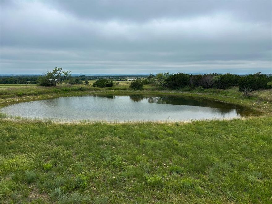 Expansive 34.5+or- acres in Gatesville, TX—Coryell County seat—offering panoramic views, peaceful seclusion, and room to build your dream home or weekend retreat. Perimeter and cross-fenced with two gated entrances, paved CR 131 frontage, water meter on site, and electric lines along the north and east boundaries. Gently rolling terrain rises to 1,100 ft elevation with sunrise and sunset views. A nice pond adds wildlife appeal. Located in Alford Ranchette Estates with easy access to Waco & Temple (1 hr), Killeen,Fort Hood (40 min), Austin (1.5 hrs), Dallas (2.5 hrs), and Houston (3.5 hrs). Enjoy the best of country living with city amenities nearby in Gatesville—Spur Capital of Texas and gateway to the Hill Country!