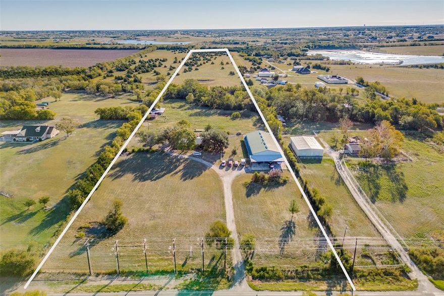 With approx 29 acres at your disposal, this property with barndominium & brick home offers the potential for expansion, development, or customization to suit your unique vision. Enjoy the vastness of your own private sanctuary, perfect for nature enthusiasts, horse lovers, outdoor activities, or potential development. Wake up to breathtaking sunrises & unwind with stunning sunsets right from your backyard. The serene landscape includes a 6000 SF 2-story barndo with approximately 4200 SF living & 1740 SF garage, 3,2,2 brick home, pond, & barn. Experience the best of both worlds with quick access to the city's amenities, shopping, & entertainment, all while maintaining your peaceful country lifestyle. Escape the hustle & bustle of city life, unwind & revel in the tranquility. Barndo on 2 acres is available in separate listing MLS 20440664-$750k. Brick home on 27 acres is available in separate MLS 20461218-$1,750,000. Needs updating but plumbing & foundation have been tested & repaired.